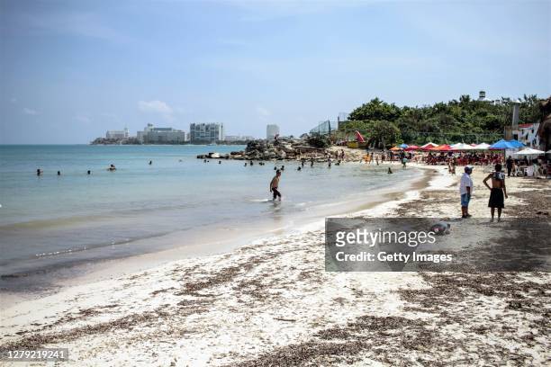 Tourists enjoy 'Playa Tortuga' one day after Hurricane Delta struck near Cancun on October 8, 2020 in Cancun, Mexico. Hurricane Delta made landfall...