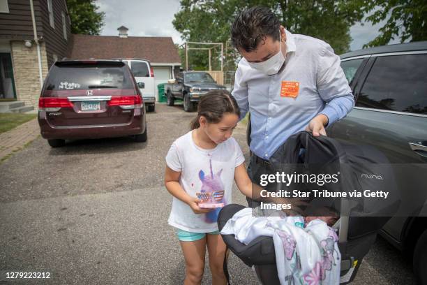 Juan Duran-Gutierrez introduced his newborn baby girl Andrea to his oldest daughter Aurora after bringing her home from North Memorial Hospital,...