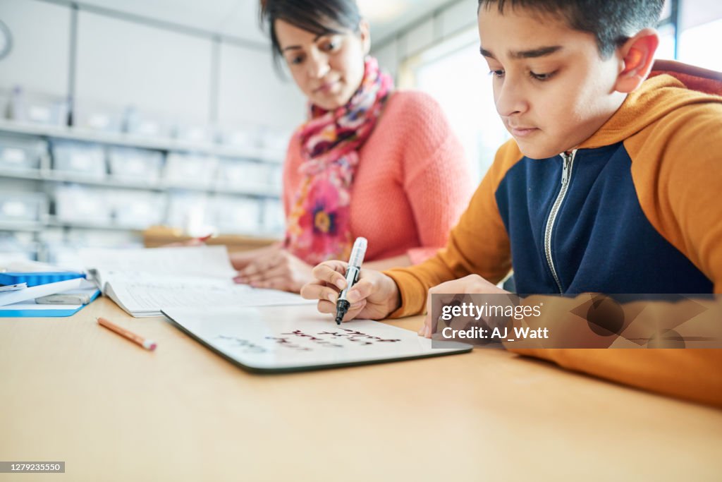 Boy Doing Classwork High-Res Stock Photo - Getty Images