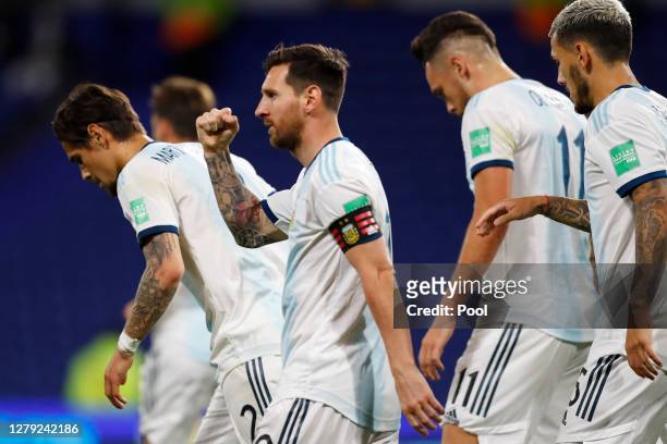 Lionel Messi of Argentina celebrates after scoring the opening goal of his team with a penalty kick during a match between Argentina and Ecuador as...