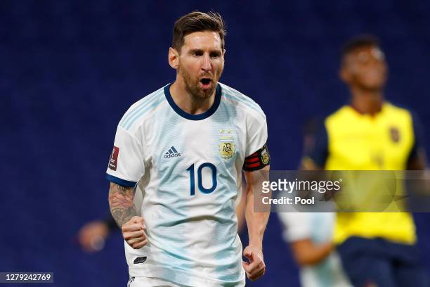 Lionel Messi of Argentina celebrates after scoring the opening goal of his team with a penalty kick during a match between Argentina and Ecuador as...