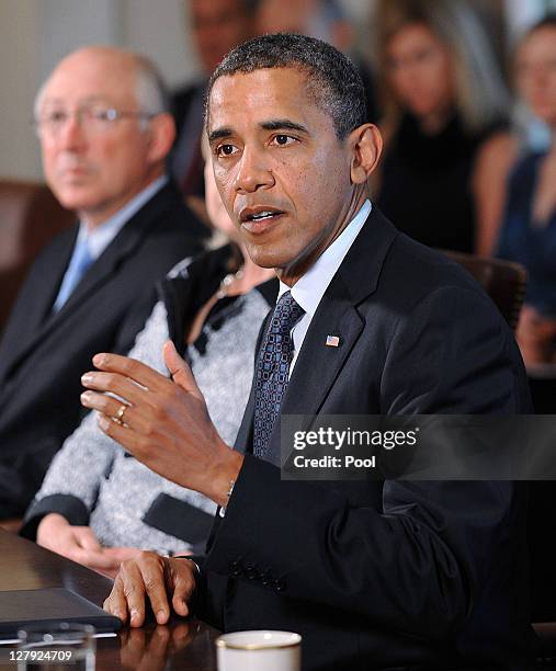 President Barack Obama speaks during a Cabinet Meeting as U.S. Secretary of Interior Kenneth Salazar listens in the Cabinet Room October 3, 2011 at...