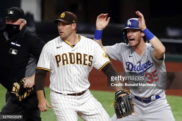 Cody Bellinger of the Los Angeles Dodgers reacts as A.J. Pollock , scores a run during the third inning against the San Diego Padres in Game Three of...