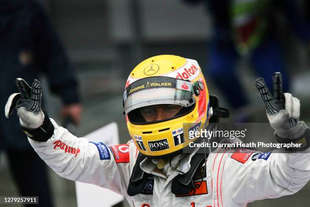 British McLaren Formula One driver Lewis Hamilton celebrates winning the 2007 Japanese Grand Prix held at the Fuji International Speedway on the 30...