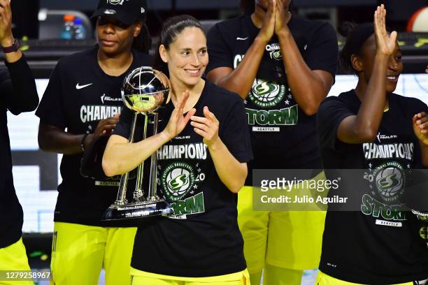 Sue Bird of the Seattle Storm celebrates while holding the trophy after winning the WNBA Championship against the Las Vegas Aces follwoing Game 3 of...