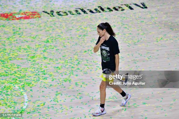 Sue Bird of the Seattle Storm walks through the confetti holding the WNBA Championship after defeating the Las Vegas Aces 92-59 in Game 3 of the WNBA...