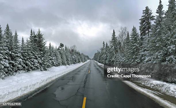 highway route 16 during winter near rangeley, maine usa - maine road stock pictures, royalty-free photos & images