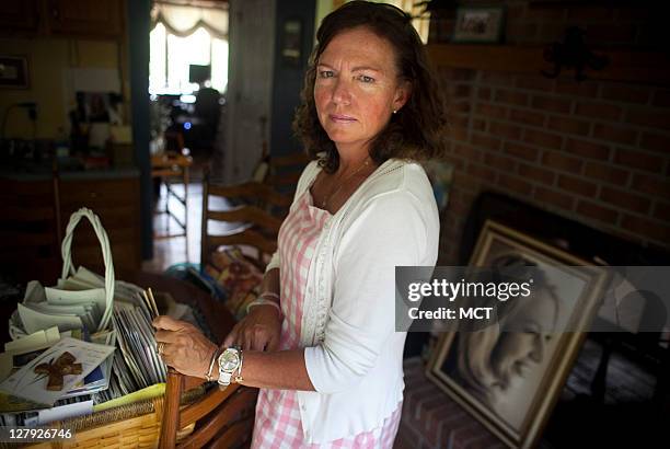 Karen Giddings, mother of slain law student Lauren Giddings, is photographed in her home with Lauren's dog "Butterbean," September 14, 2011. In the...