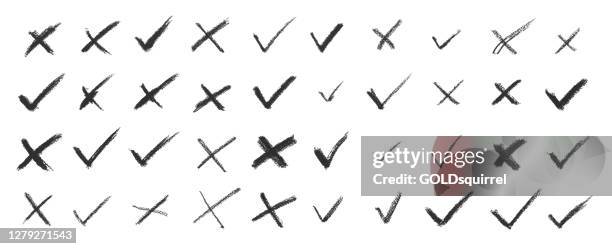 set of strokes in cross x / no button shape and check / ok mark symbol in vector - original modern dirty uneven unfinished spontanious hand-drawn art with uneven lines made by charcoal isolated on white background - stock design illustration - cross stock illustrations