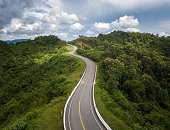 Aerial view of beautiful steep curved road (look like number 3) on the high mountain in Nan province, Thailand.
