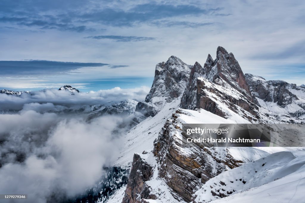 Snowcapped Seceda Mountain peak and Odle group, Gardena Valley, South Tyrol, Italy
