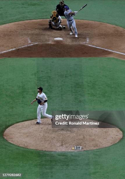 Will Smith of the Los Angeles Dodgers hits a two-run RBI double during the ninth inning against Trevor Rosenthal of the San Diego Padres in Game...