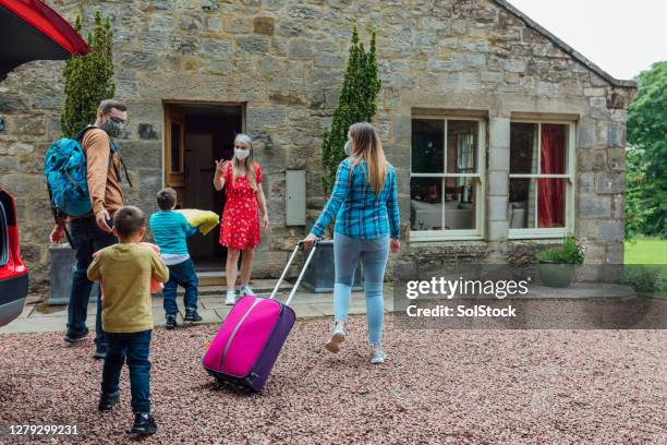 welcome to the bed and breakfast - family luggage stock pictures, royalty-free photos & images