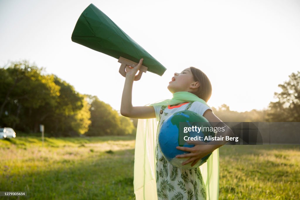 Female Eco-warrior shouting into a megaphone