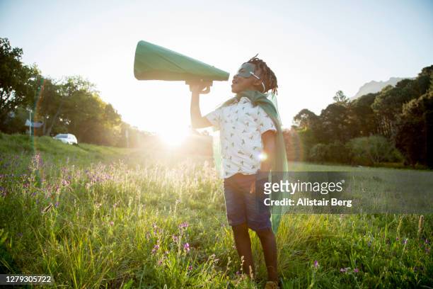 eco-warrior shouting into a megaphone - climate change children stock pictures, royalty-free photos & images