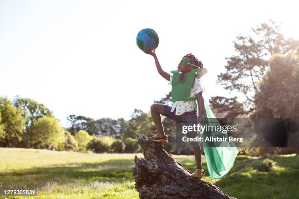 african boy dressed as an eco warrior - summer super 8 stockfoto's en -beelden