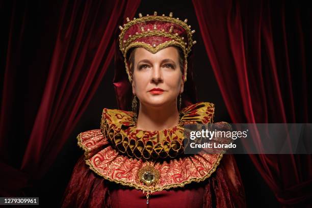 historical queen character on the throne - queen throne stock pictures, royalty-free photos & images