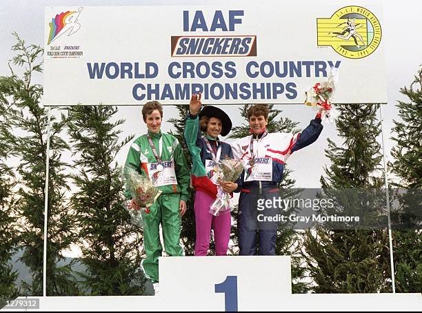 Catherina McKiernan of Ireland, winner Albertina Dias of Portugal and Lynn Jennings of the USA on the podium after the World Cross Country...