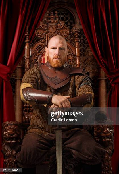 historical viking king on the throne in studio shoot - barbarian stock pictures, royalty-free photos & images