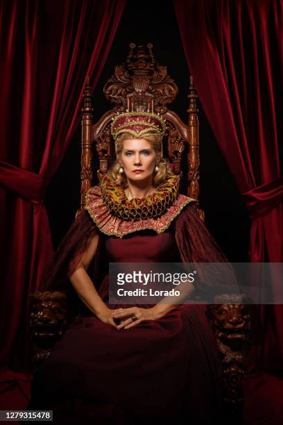 historical queen character on the throne - throne stock pictures, royalty-free photos & images