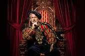 Historical King on the throne in studio shoot