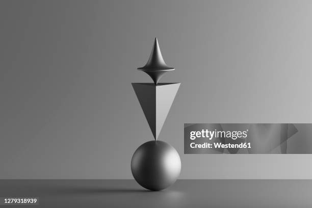 three dimensional render of metallic top spinning on top of geometric pyramid and sphere - spinning top stock illustrations