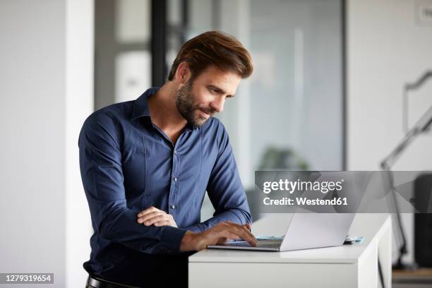 Man Standing Computer Man Standing Laptop Photos and Premium High Res Pictures - Getty Images