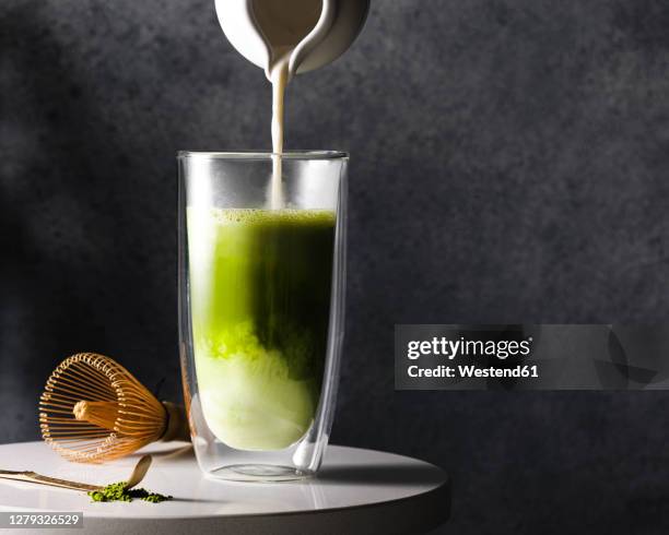 preparation of matcha latte - matcha tea stock pictures, royalty-free photos & images