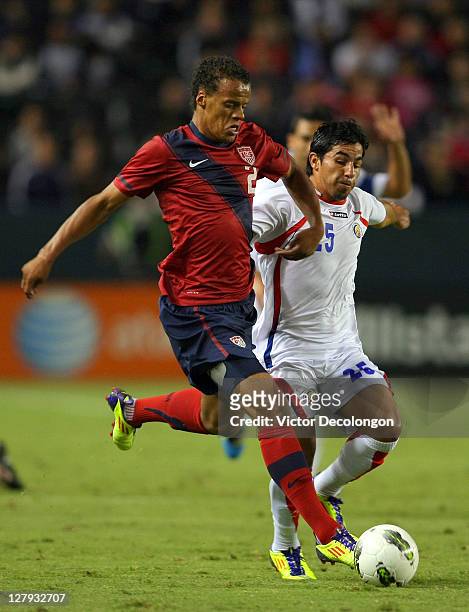 Timmy Chandler of the USA paces the ball on the attack against Alvaro Sanchez of Costa Rica during the International Friendly match at The Home Depot...