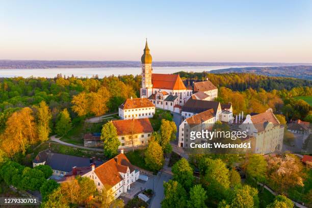 germany, bavaria, andechs, drone view of andechs abbey and surrounding buildings at dusk - starnberg photos et images de collection