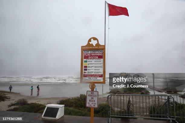 Dangerous Current" flag flies over Galveston Beach as the outer bands of Hurricane Delta pass through on October 09, 2020 in Galveston, Texas....
