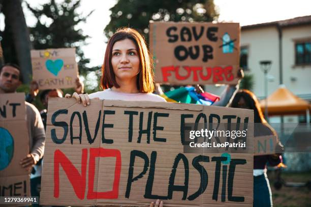 activists demonstrating against global warming - climate change protest stock pictures, royalty-free photos & images