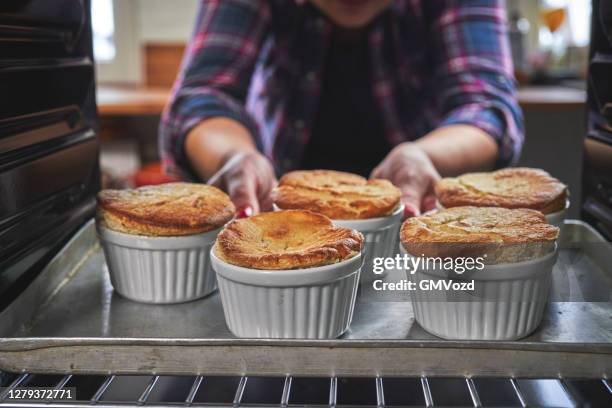 baking mango banana souffle in the oven - souffle stock pictures, royalty-free photos & images