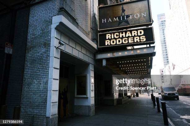 Broadway theaters stand closed along an empty street in the theater district on October 9, 2020 in New York City. The Broadway League, a trade...