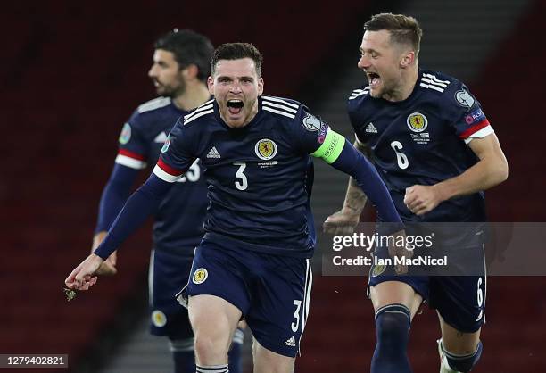 Andy Robertson of Scotland celebrates after his teams victory in the penalty shoot out during the UEFA EURO 2020 Play-Off semi-finals match between...