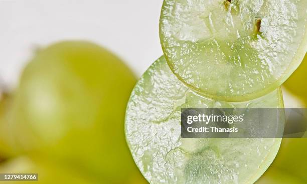 green grapes slices - white grape stock pictures, royalty-free photos & images