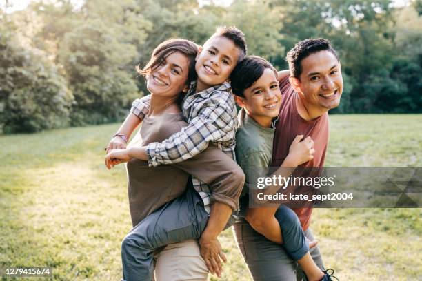portrait of young mexican family - daily life in canada stock pictures, royalty-free photos & images