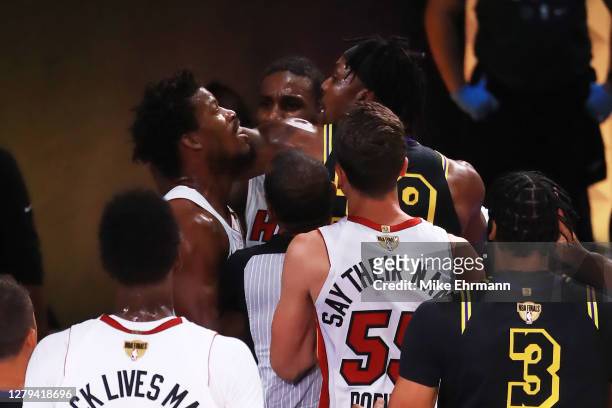 Jimmy Butler of the Miami Heat and Dwight Howard of the Los Angeles Lakers get into an altercation during the first quarter in Game Five of the 2020...