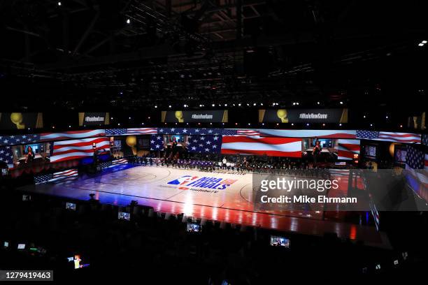 The Los Angeles Lakers and the Miami Heat kneel during the National Anthem prior to the start of the game in Game Five of the 2020 NBA Finals at...
