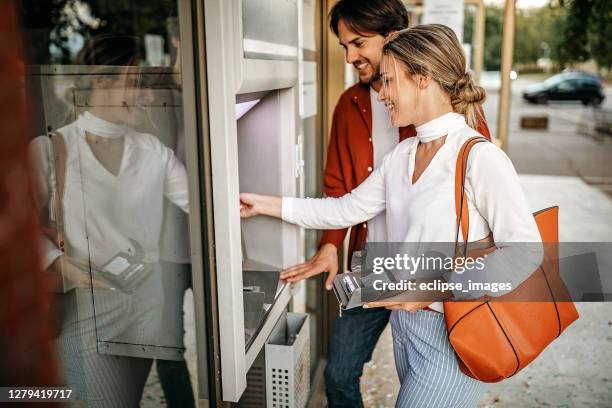 easy way to carry money with us - man atm smile stock pictures, royalty-free photos & images