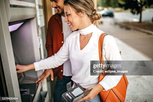 easy way to carry money with us - man atm smile stock pictures, royalty-free photos & images