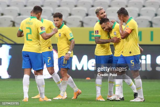 Philippe Coutinho of Brazil celebrates the fifth goal of his team with teammate Neymar Jr. During a match between Brazil and Bolivia as part of South...