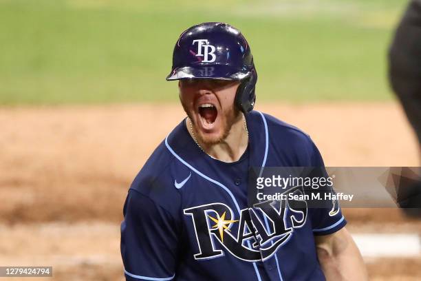 Michael Brosseau of the Tampa Bay Rays celebrates after hitting a solo home run against the New York Yankees during the eighth inning in Game Five of...