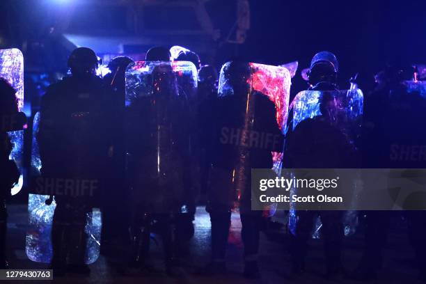 Police and National Guard advance on protestors occupying the street near the Wauwatosa City Hal on October 09, 2020 in Wauwatosa, Wisconsin. The...