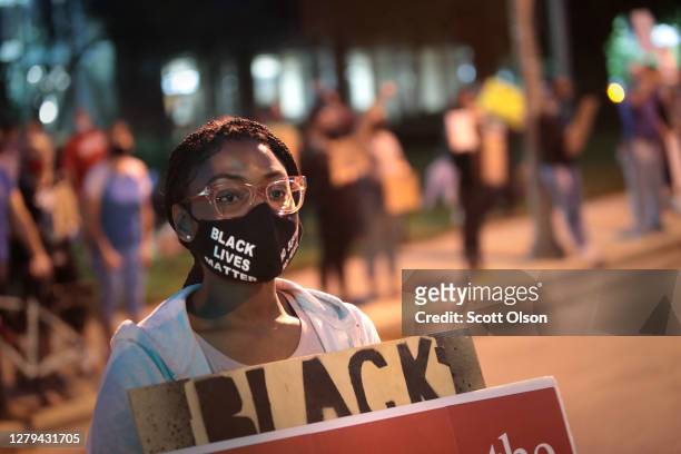 Protestors demonstrate near the Wauwatosa City Hal on October 09, 2020 in Wauwatosa, Wisconsin. The city has faced three days of demonstrations,...