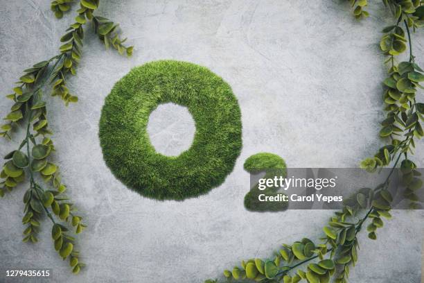 oxygen text made on green grass in grey background - grass clearcut stock pictures, royalty-free photos & images