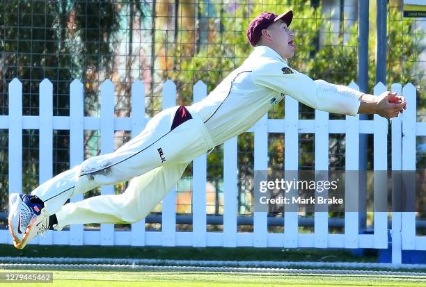 Marnus Labuschagne of the Queensland Bulls catches Beau Webster of the Tasmanian Tigers on the boundary during day one of the Sheffield Shield match...