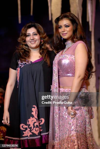 Archana Kochar and Ayesha Takial walk the ramp at the grand finale show on Day 5 of India International Jewellery Week on August 19, 2010 in Mumbai,...