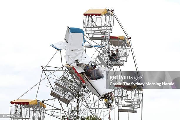 Light plane crashed into the Ferris wheel at Old Bar, near Taree on the NSW North Coast. Rescue workers were able to free the passenger and pilot as...