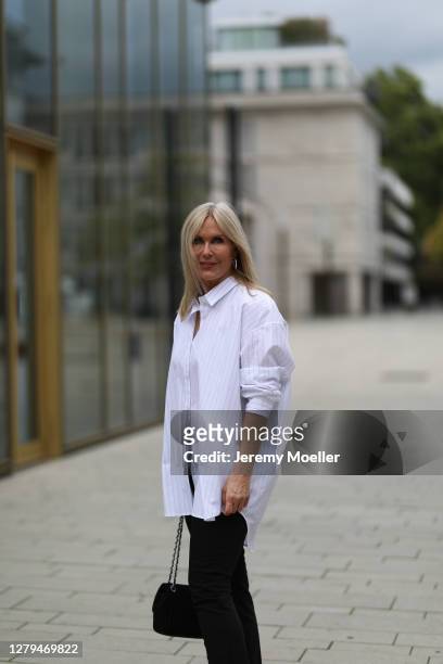 Judith Mosqueira do Amaral wearing a Seidensticker shirt, Chanel bag and black jeans on October 07, 2020 in Cologne, Germany.